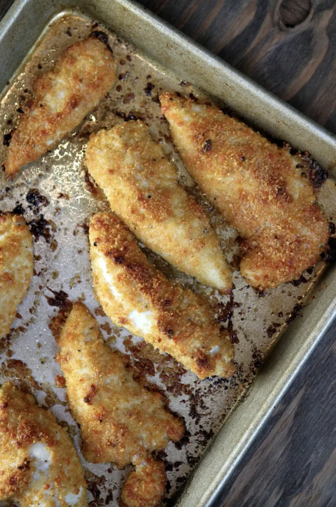 25 Easy Family Friendly Chicken Dinner Recipes from RecipeBoy.com Baked Parmesan Chicken Tenders on a baking sheet