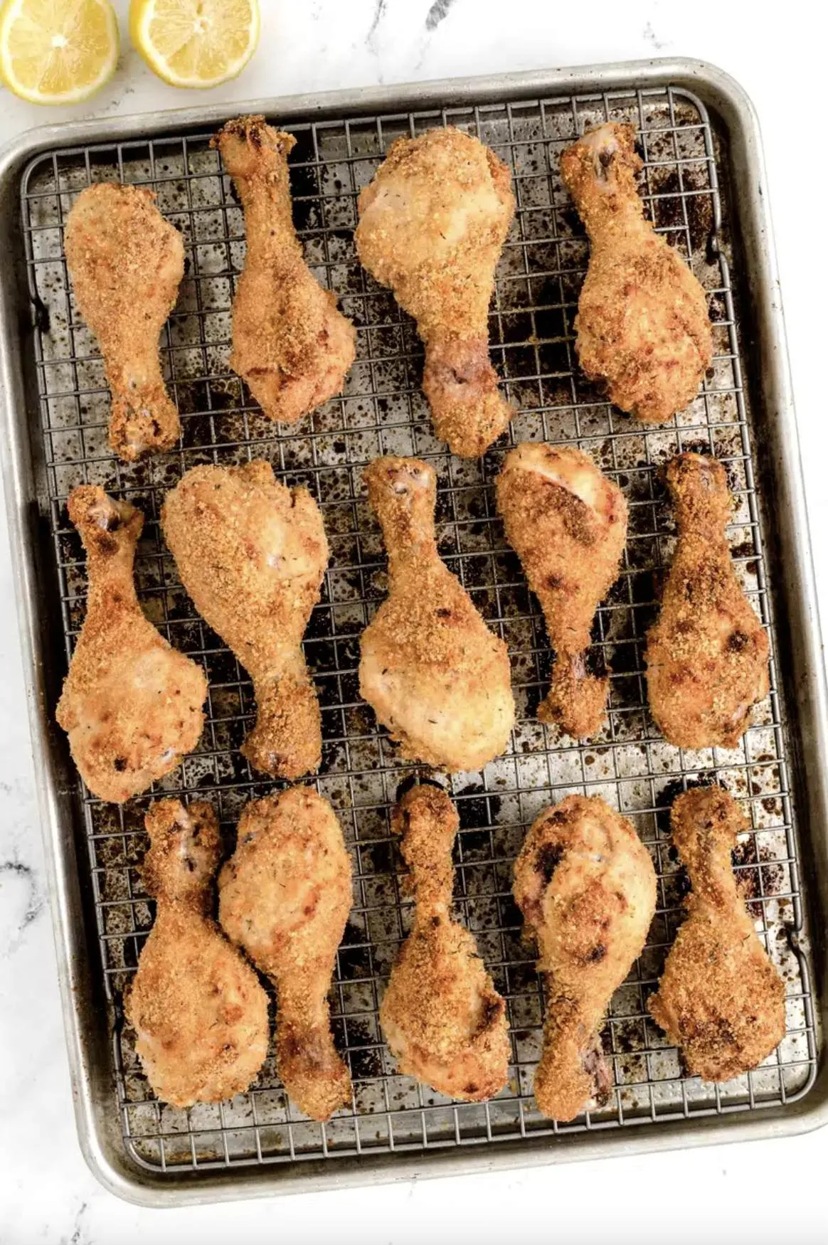25 Easy Family Friendly Chicken Dinner Recipes from RecipeBoy.com Lemonade Chicken Drumsticks on a baking sheet