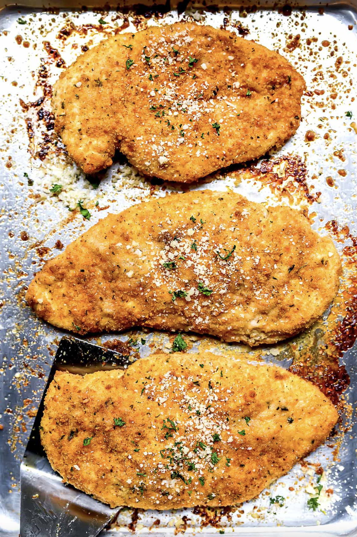 three parmesan crusted chicken breasts
