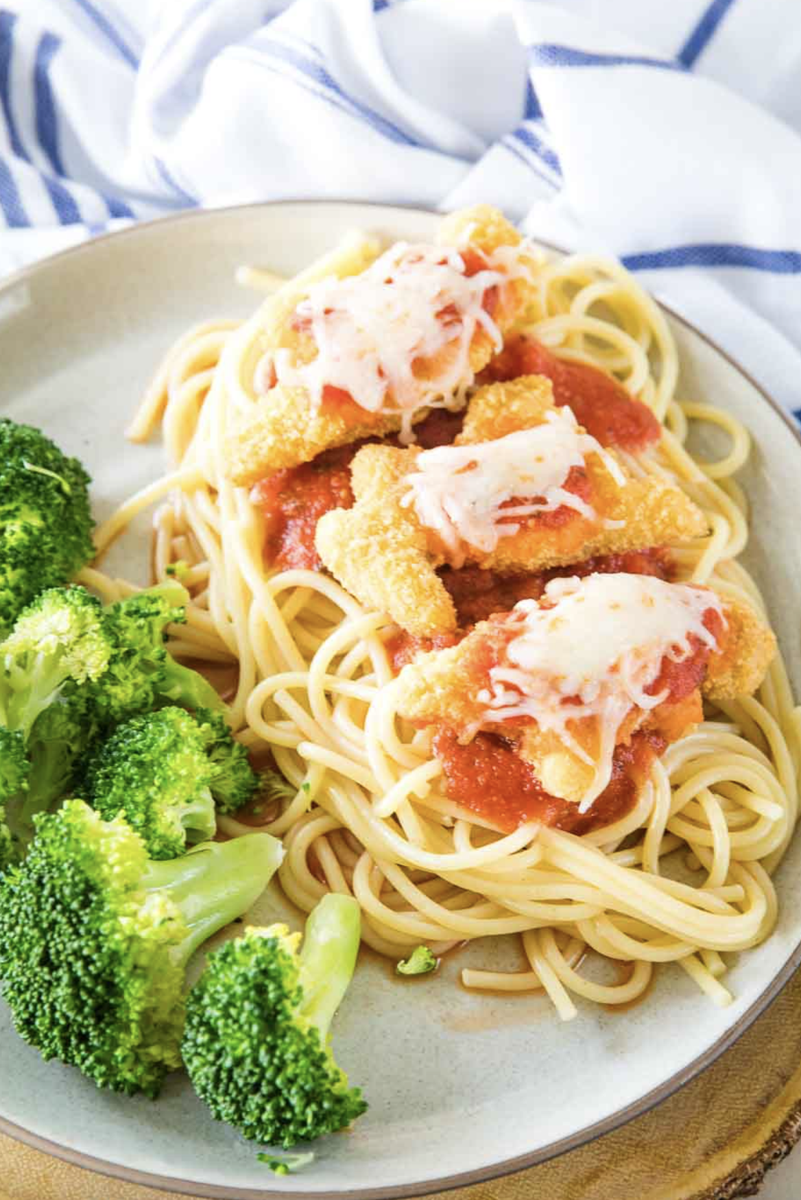 dino buddies chicken parmesan on pasta with broccoli