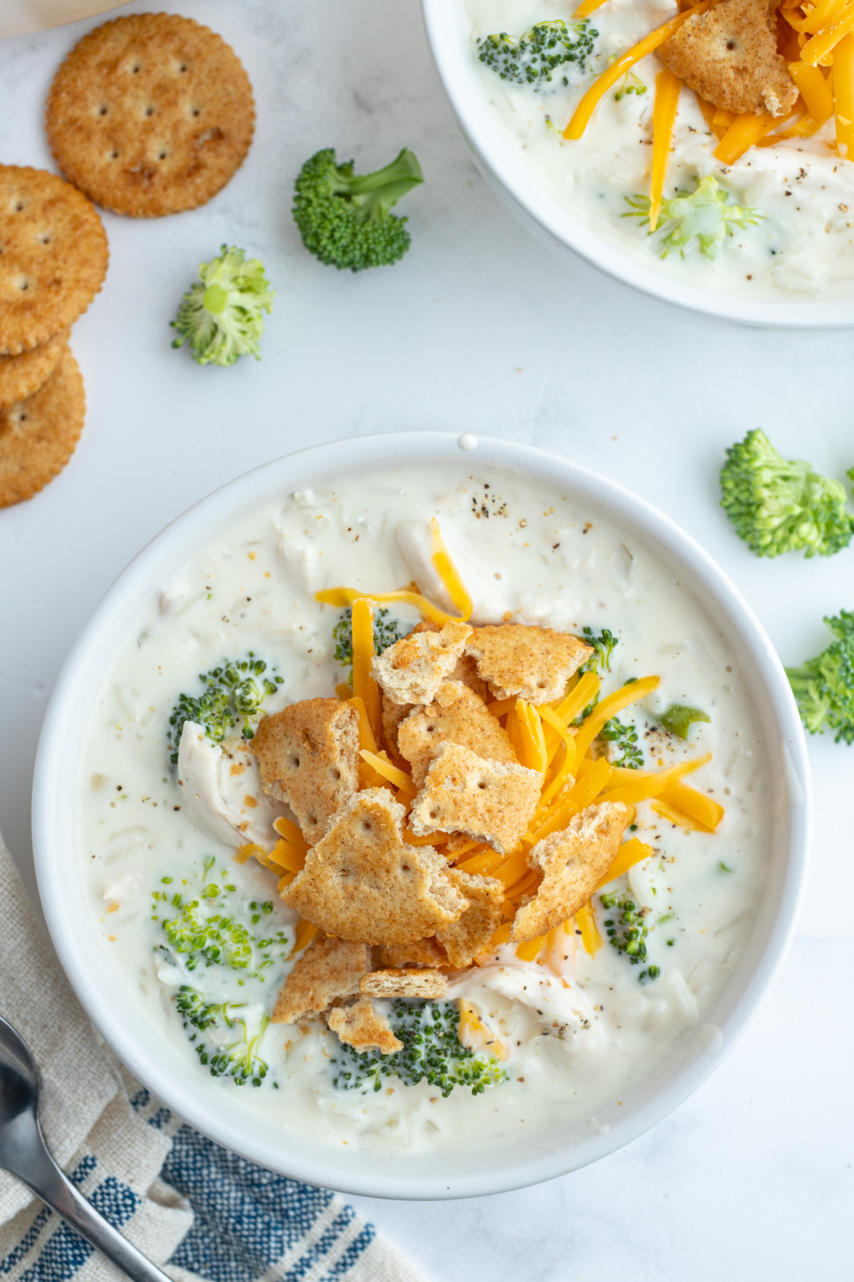 creamy chicken broccoli and rice soup over head shot of bowl