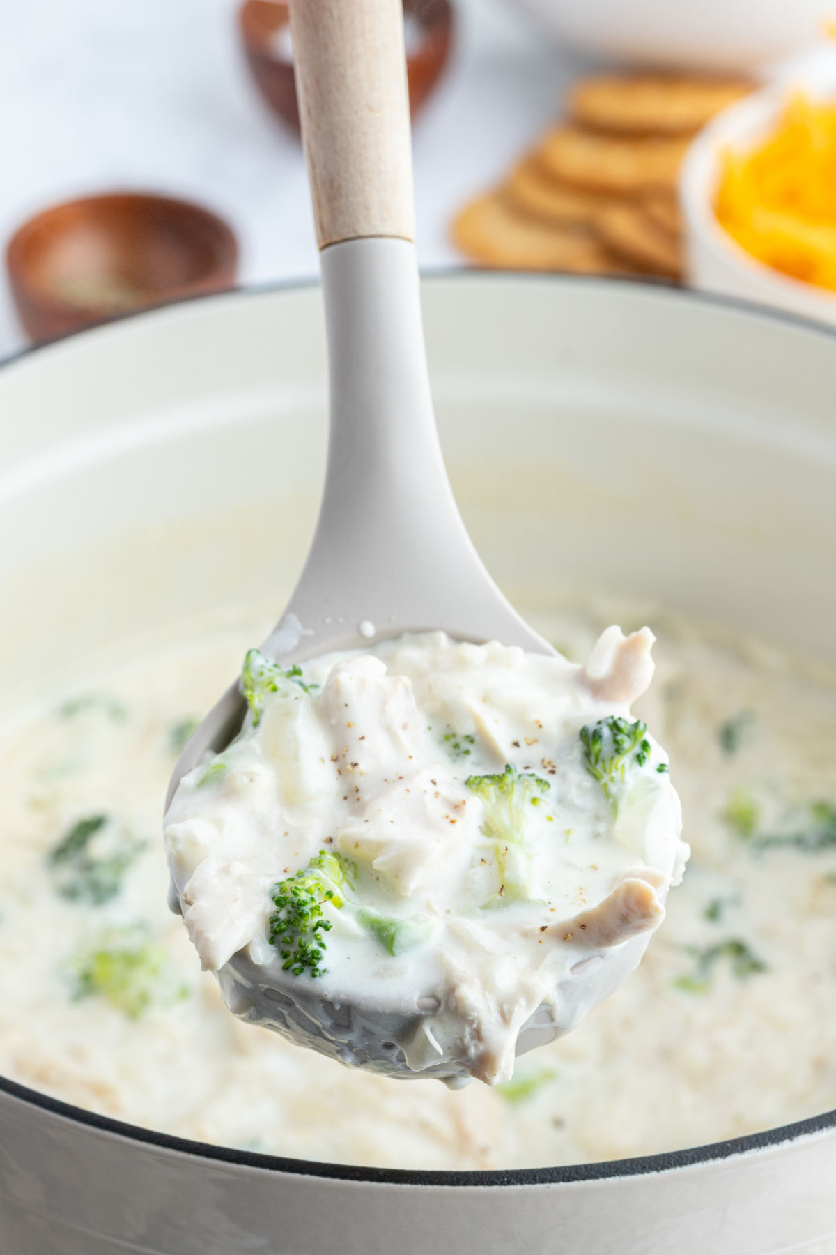 ladle full of creamy chicken broccoli and rice soup