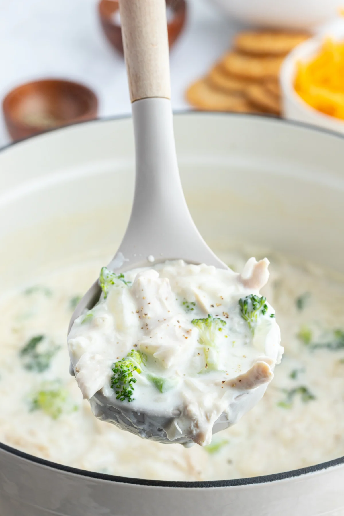 ladle full of creamy chicken broccoli and rice soup