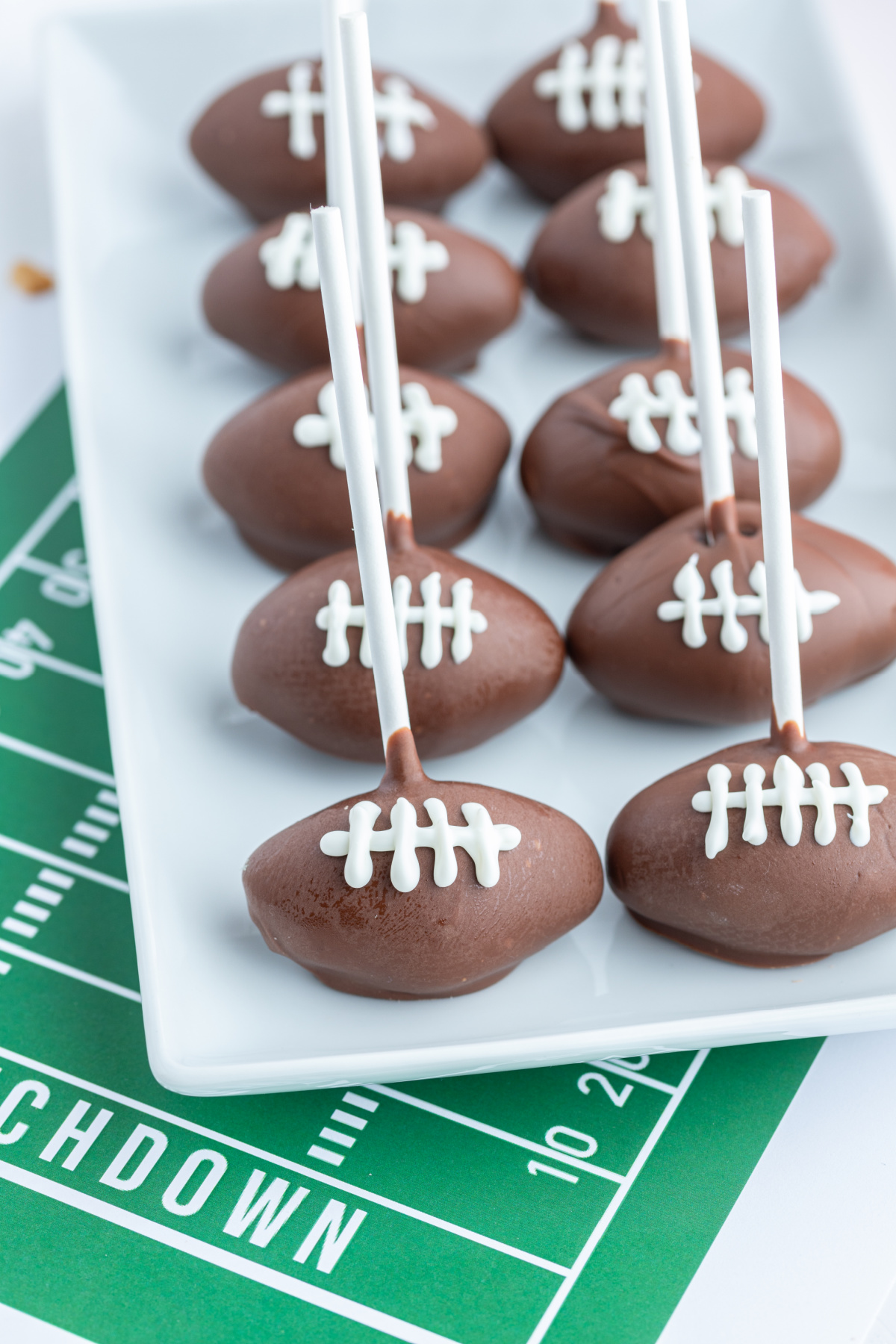 football cake pops on a platter