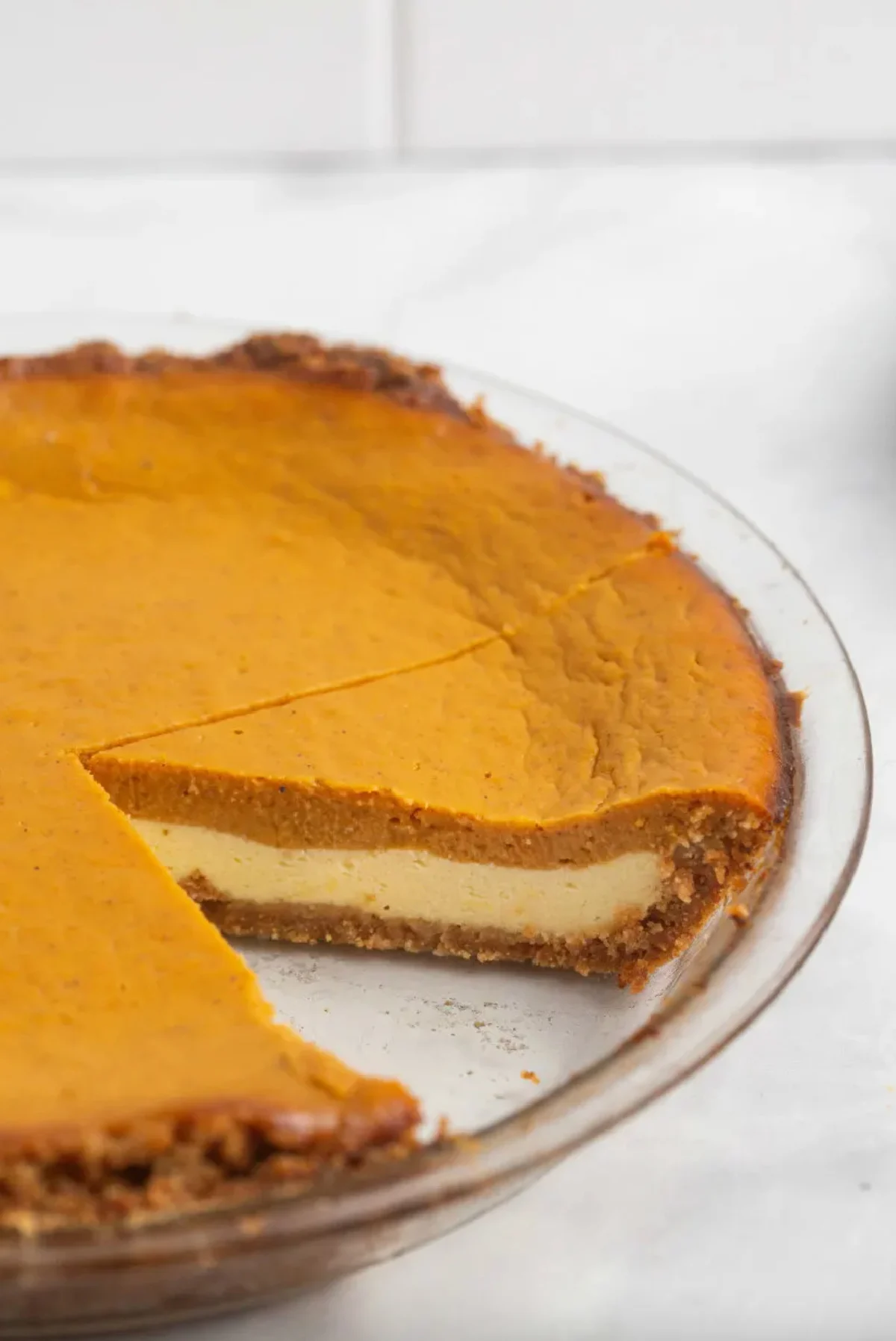 pumpkin cream cheese pie with slice taken out