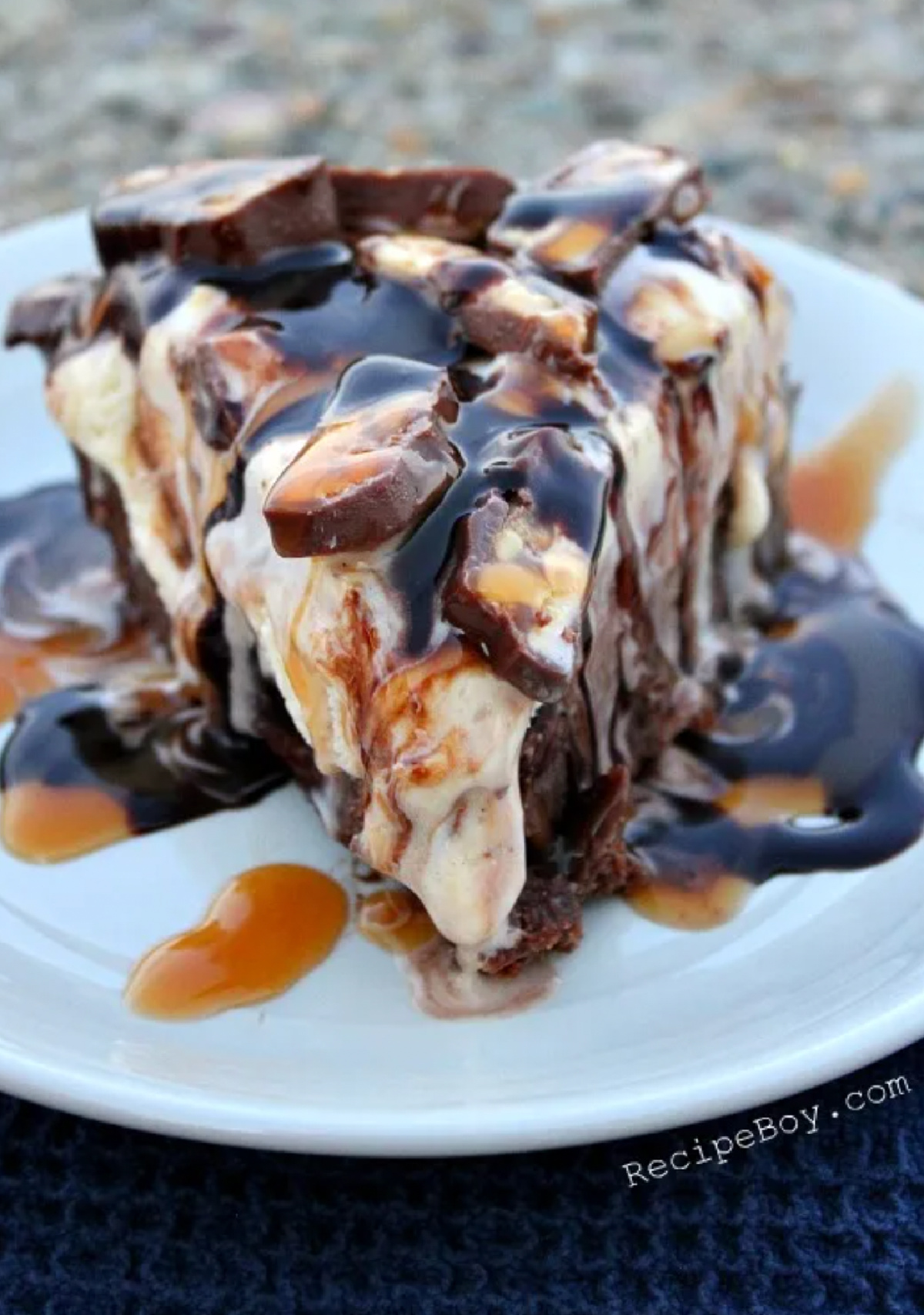 slice of snickers ice cream brownie pie on plate