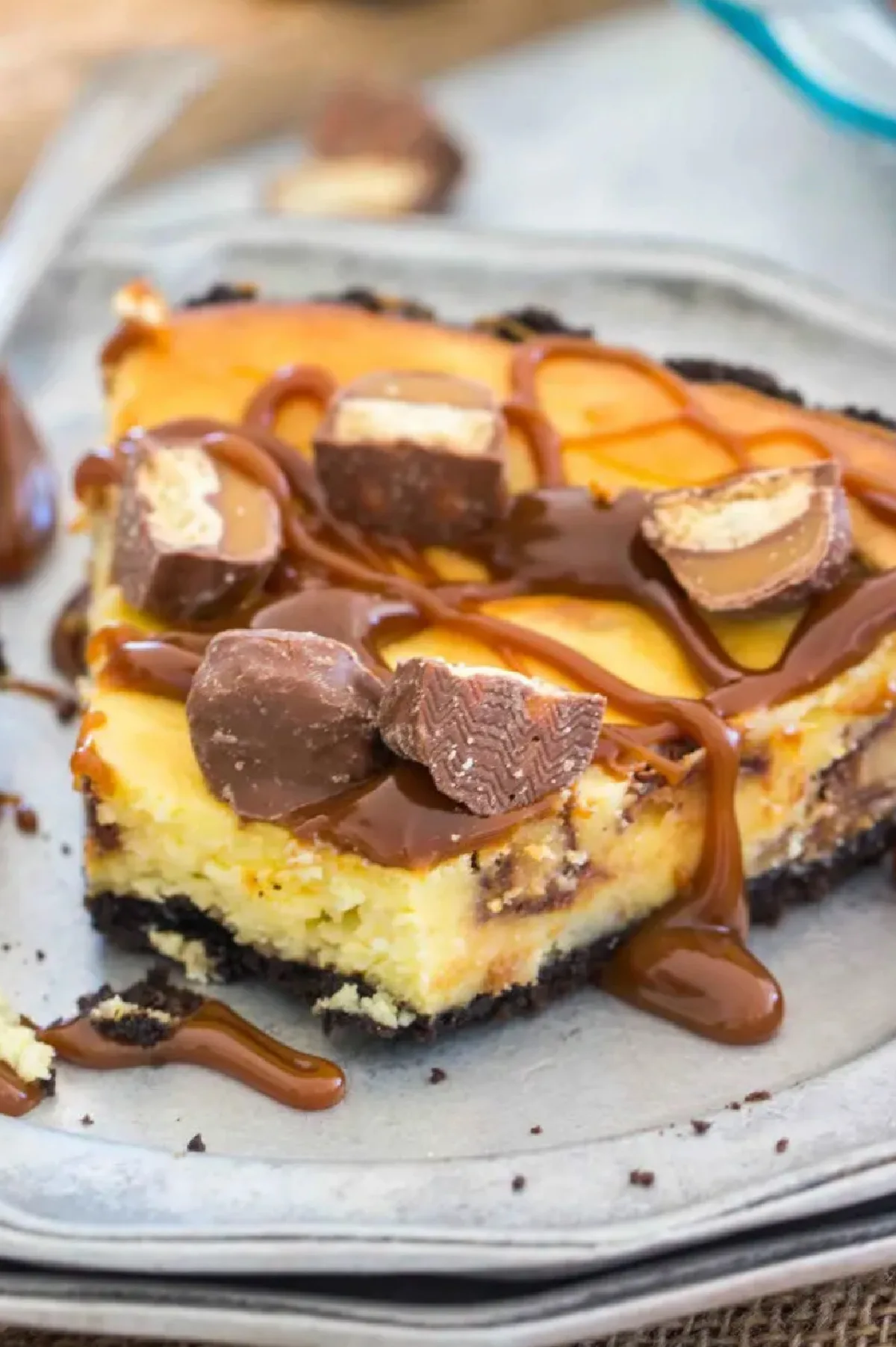 slice of twix bar cheesecake pie