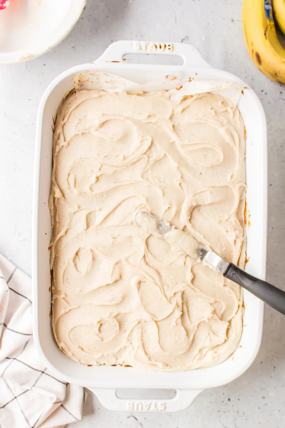 pan of banana bread bars with brown butter frosting