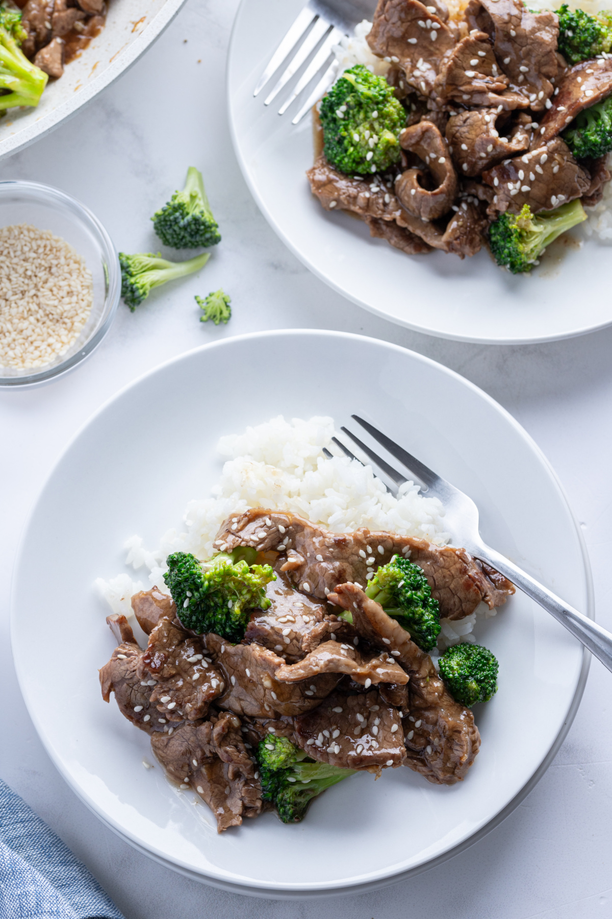 beef and broccoli stir fry on plate with rice