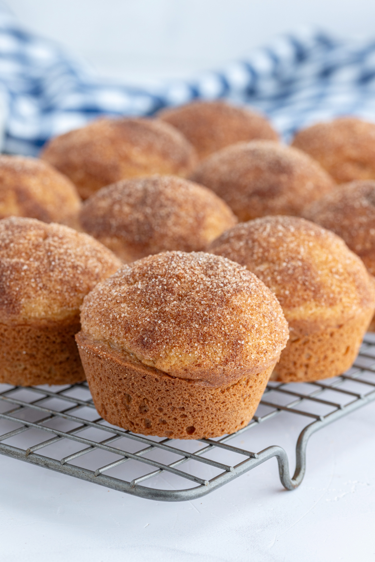 cinnamon sugar muffins on cooling rack