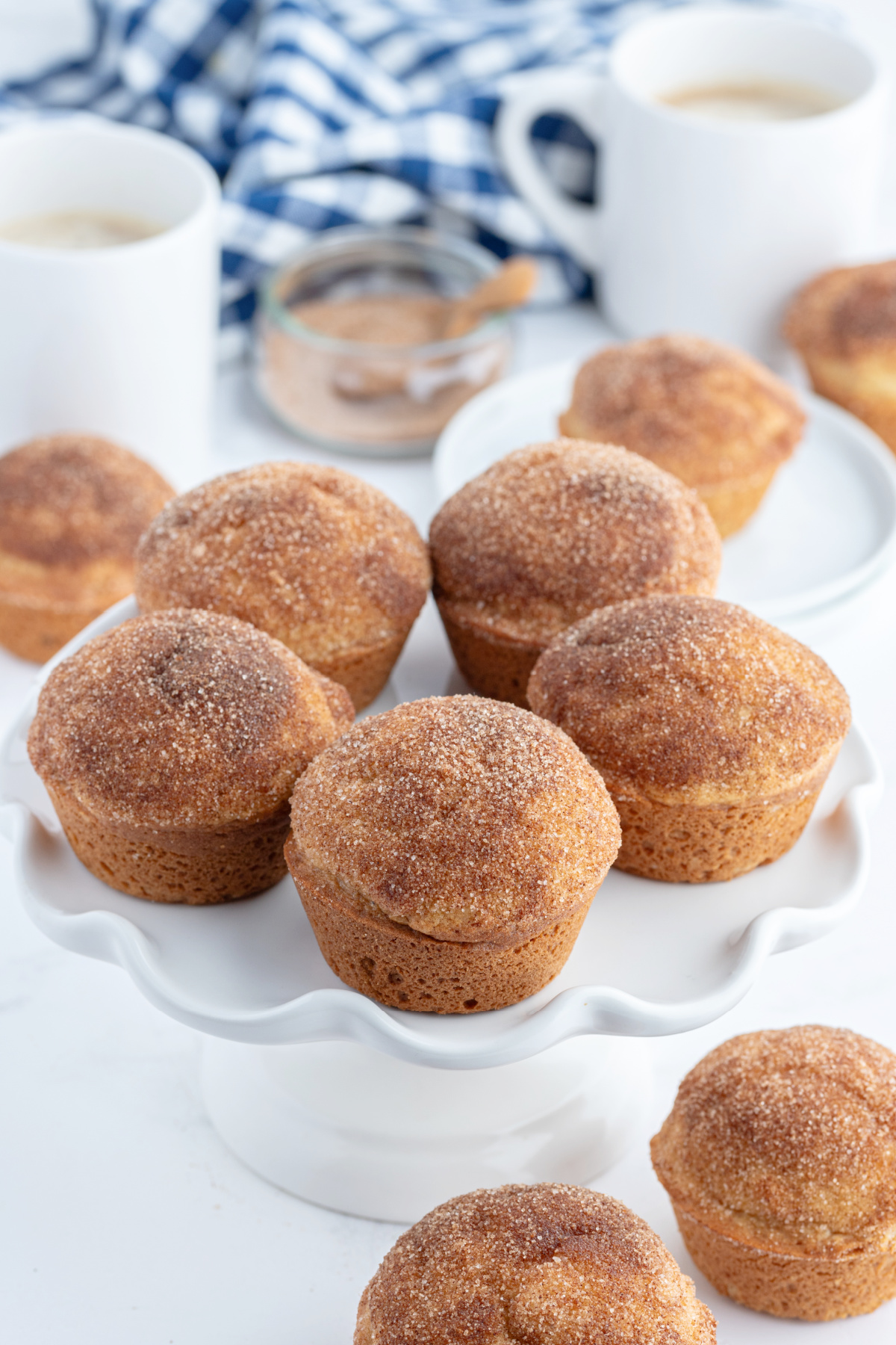 cake display with cinnamon sugar muffins