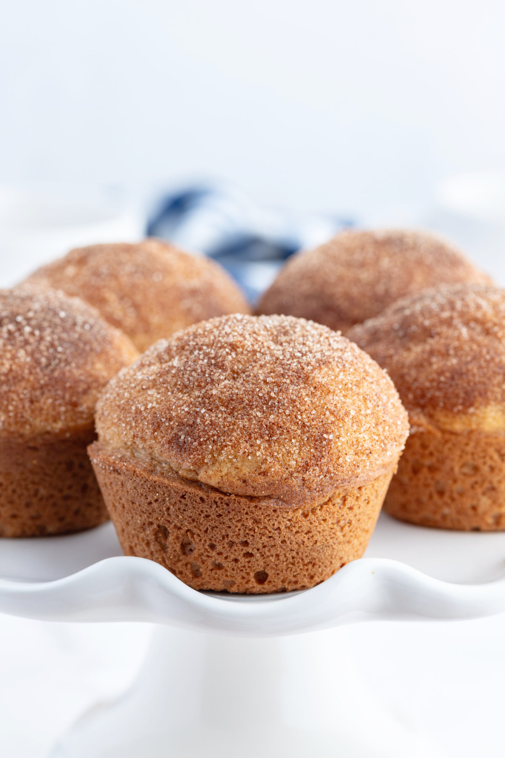 cinnamon sugar muffins on cake display