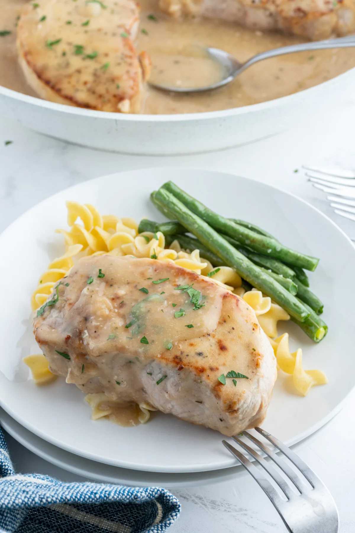 ranch pork chop on plate with green beans