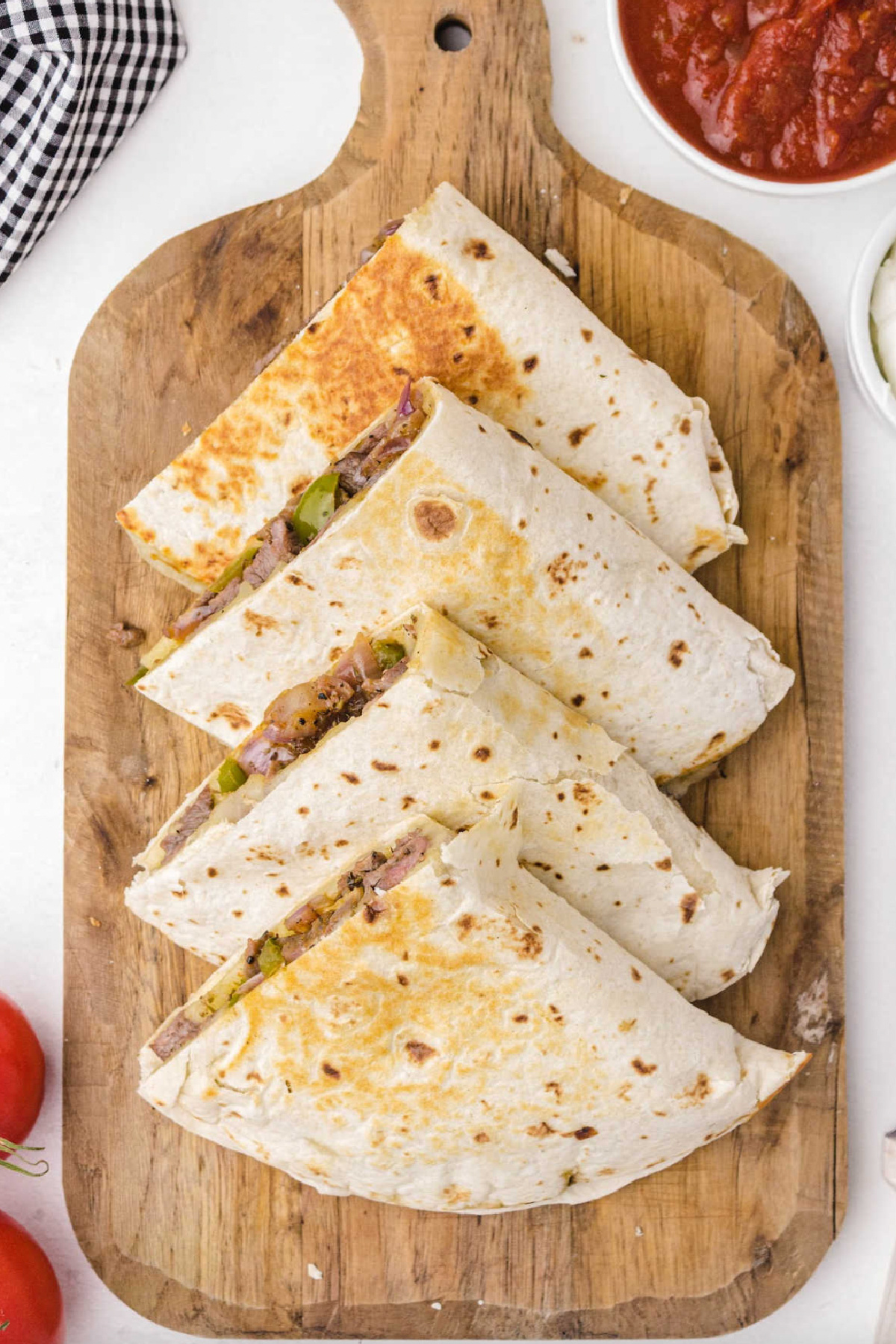 steak quesadillas on a board