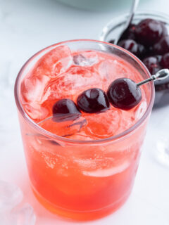 tequila shirley temple with cherry garnish