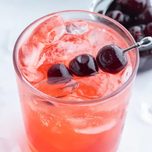 tequila shirley temple with cherry garnish
