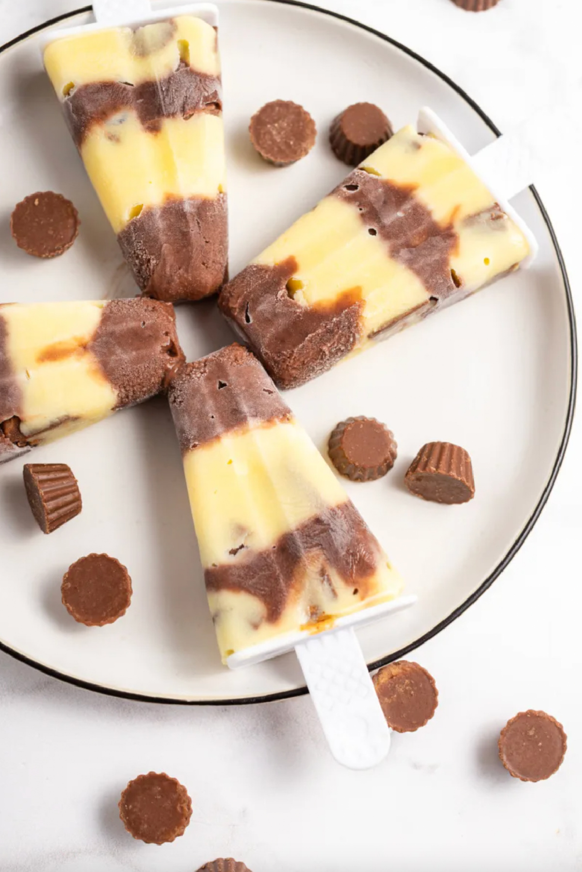 21 Impressive and Easy Summer Dessert Recipes collection on RecipeBoy.com four reeses pudding pops on a plate