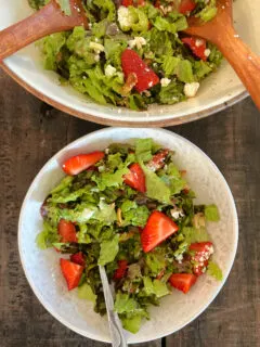 strawberry almond salad in bowl and one serving in bowl