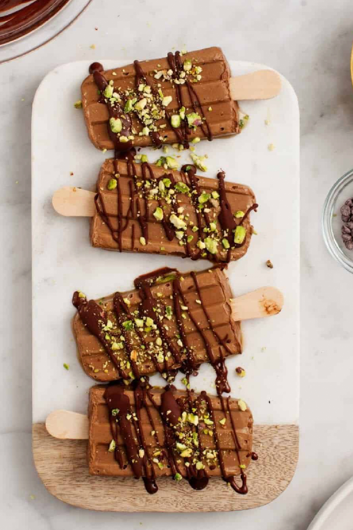 chocolate pudding pops laid on surface