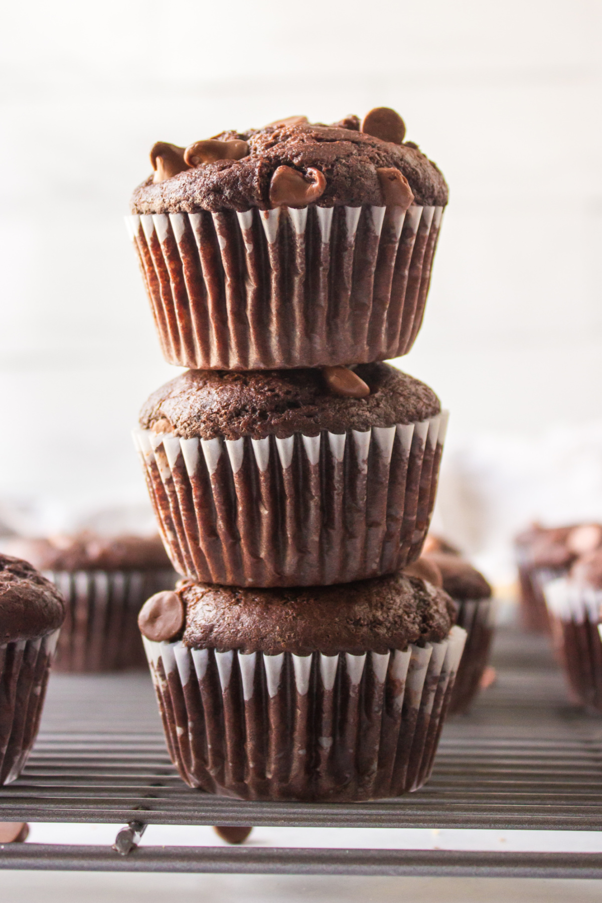 three chocolate espresso muffins stacked