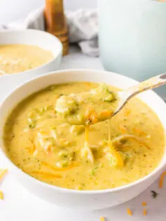bowl of broccoli cheese soup with spoon
