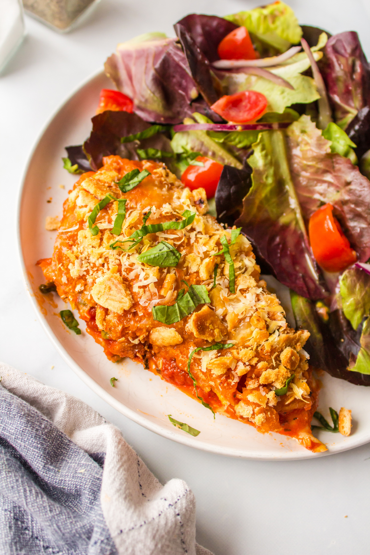 Baked Parmesan Chicken recipe from RecipeGirl.com Easy weeknight Baked Parmesan Chicken served with salad and garlic bread.