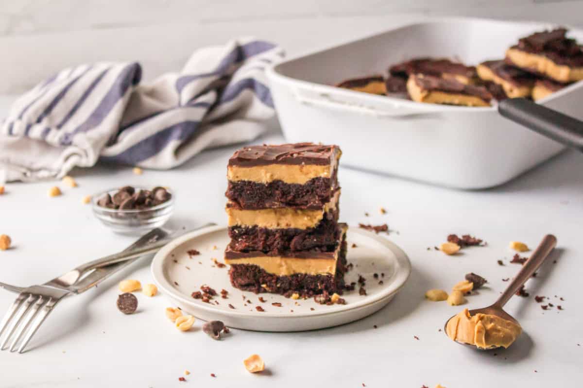 three buckeye brownies stacked on plate