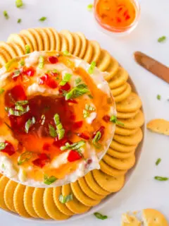 pepper jelly cream cheese dip surrounded by crackers