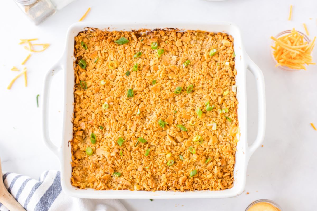 white casserole dish with ritz chicken casserole in it