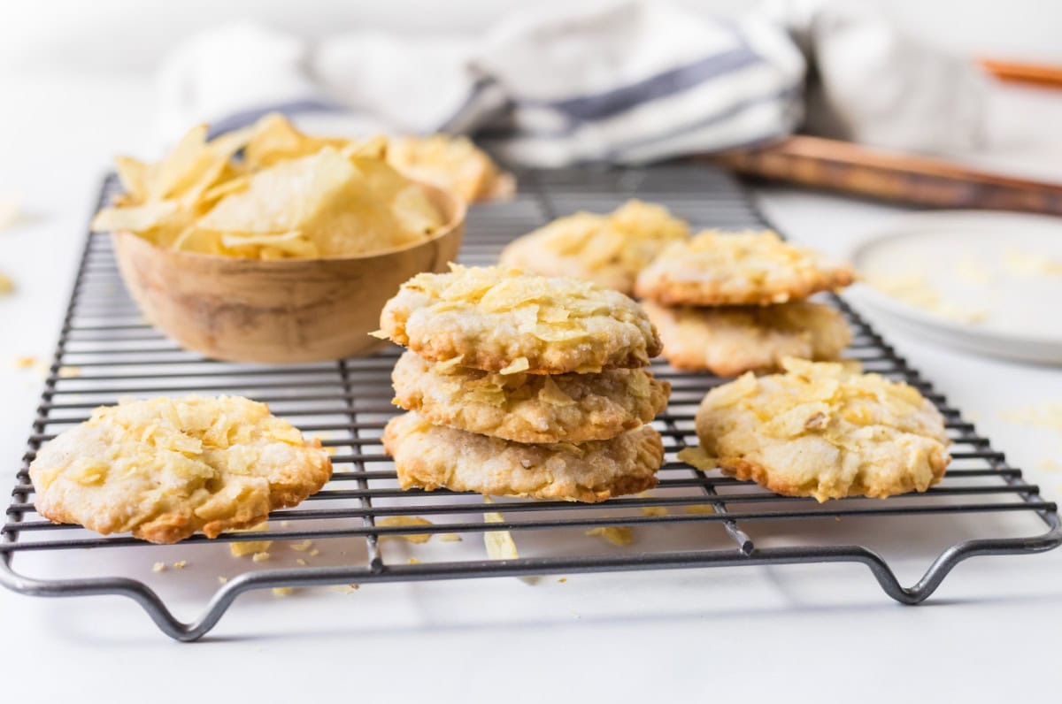 Potato Chip Cookies are sweet, salty and buttery with a unique crunch. An easy cookie recipe that everyone loves. potato chips cookies stacked on cooling rack