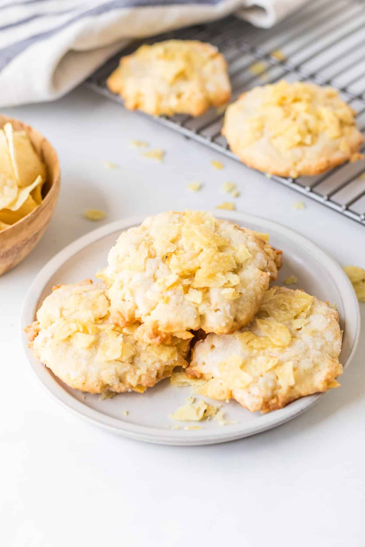 Potato Chip Cookies are sweet, salty and buttery with a unique crunch. An easy cookie recipe that everyone loves. three potato chips cookies on a plate