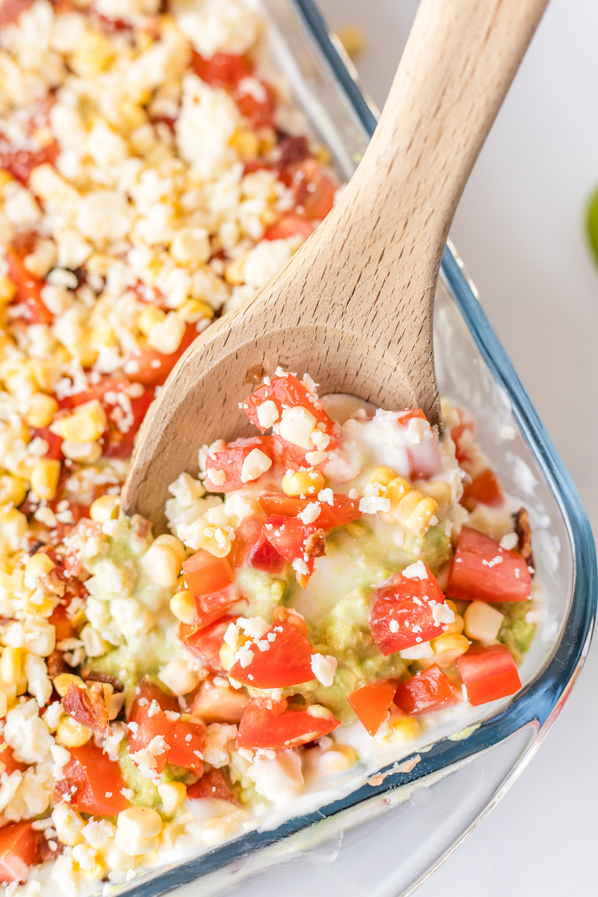 wooden spoon in 7 layer dip