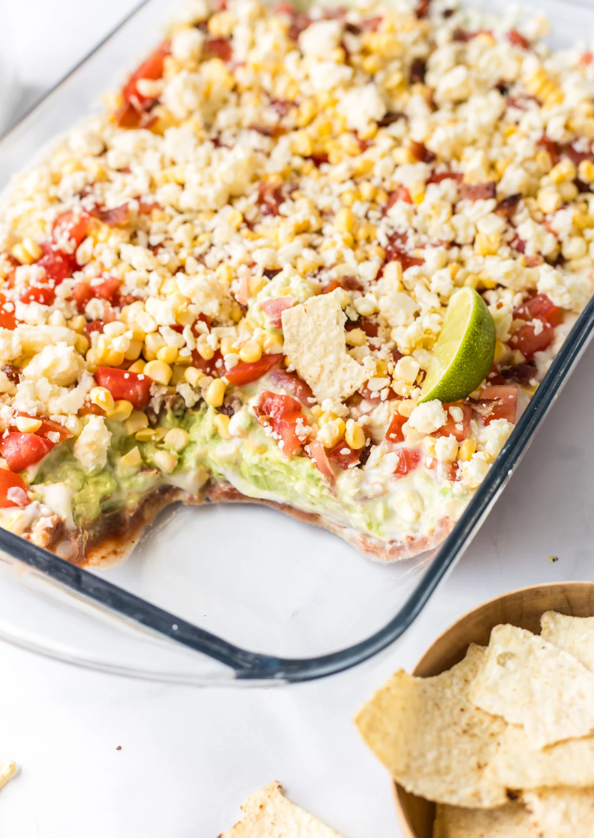7 Layer Mexican Dip recipe from RecipeBoy.com 7 layer mexican dip with portion taken out of it