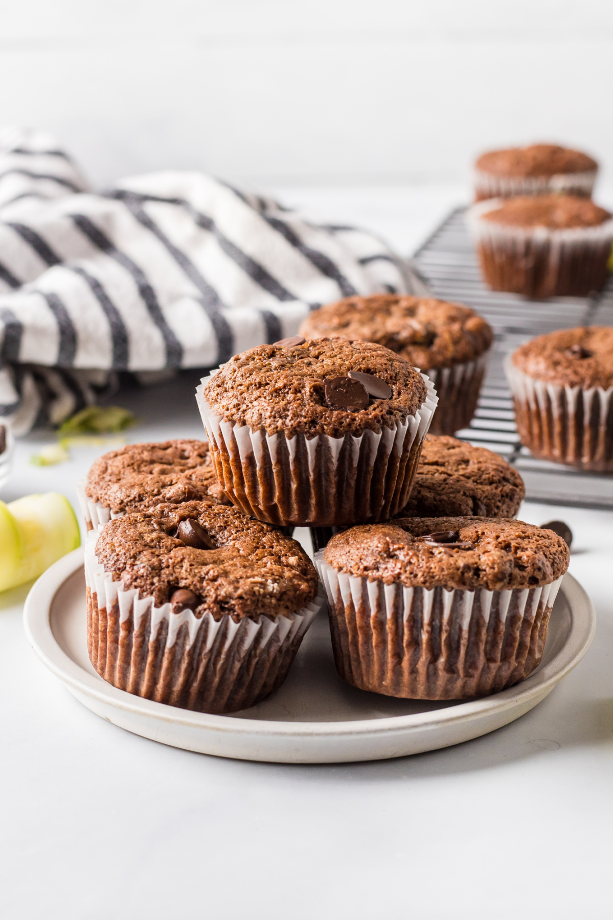 Chocolate Zucchini Muffins recipe from RecipeBoy.com plate of stacked chocolate zucchini muffins