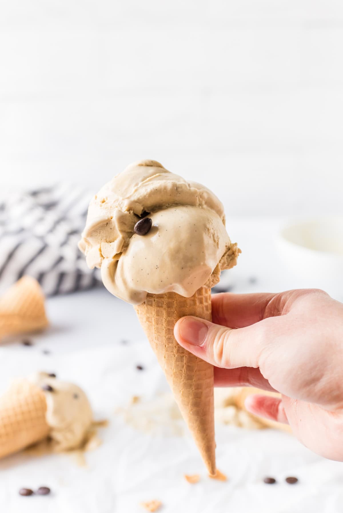 hand holding coffee ice cream cone