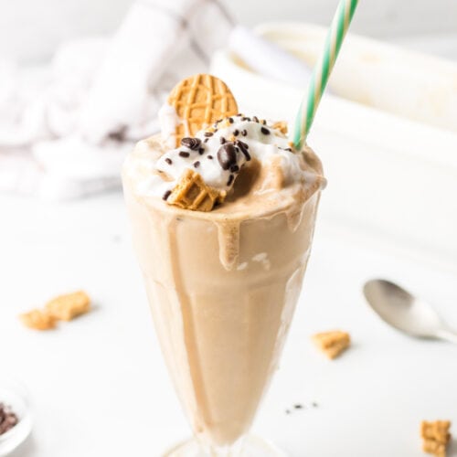 coffee milkshake with straw and garnishes