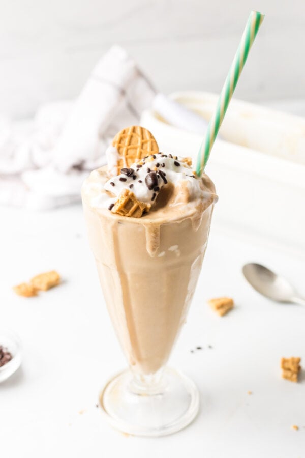 coffee milkshake with straw and garnishes