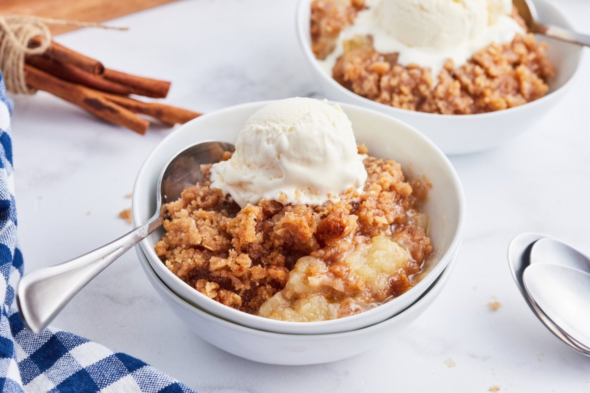 bowl of apple betty with ice cream on top