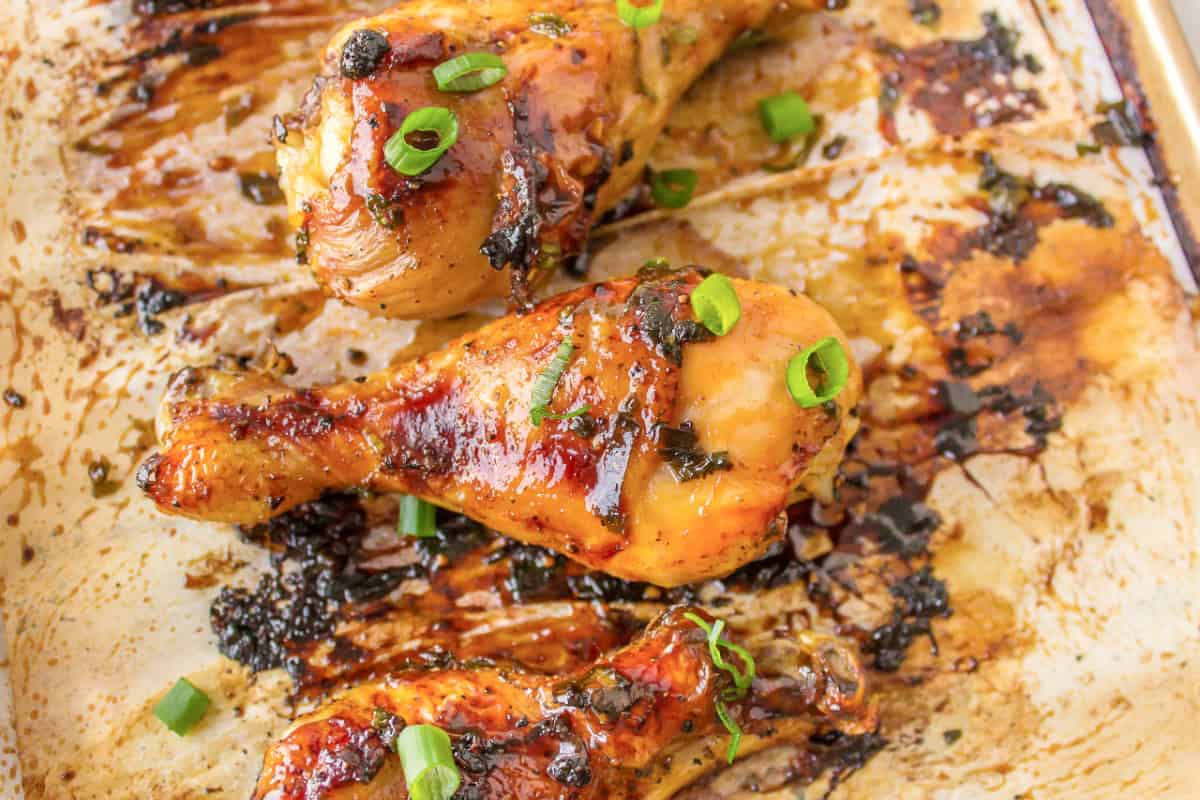 This Honey Chicken Drumsticks recipe is an easy, family friendly dinner recipe, and you will only need 5 ingredients to make it. honey chicken drumsticks on a baking sheet
