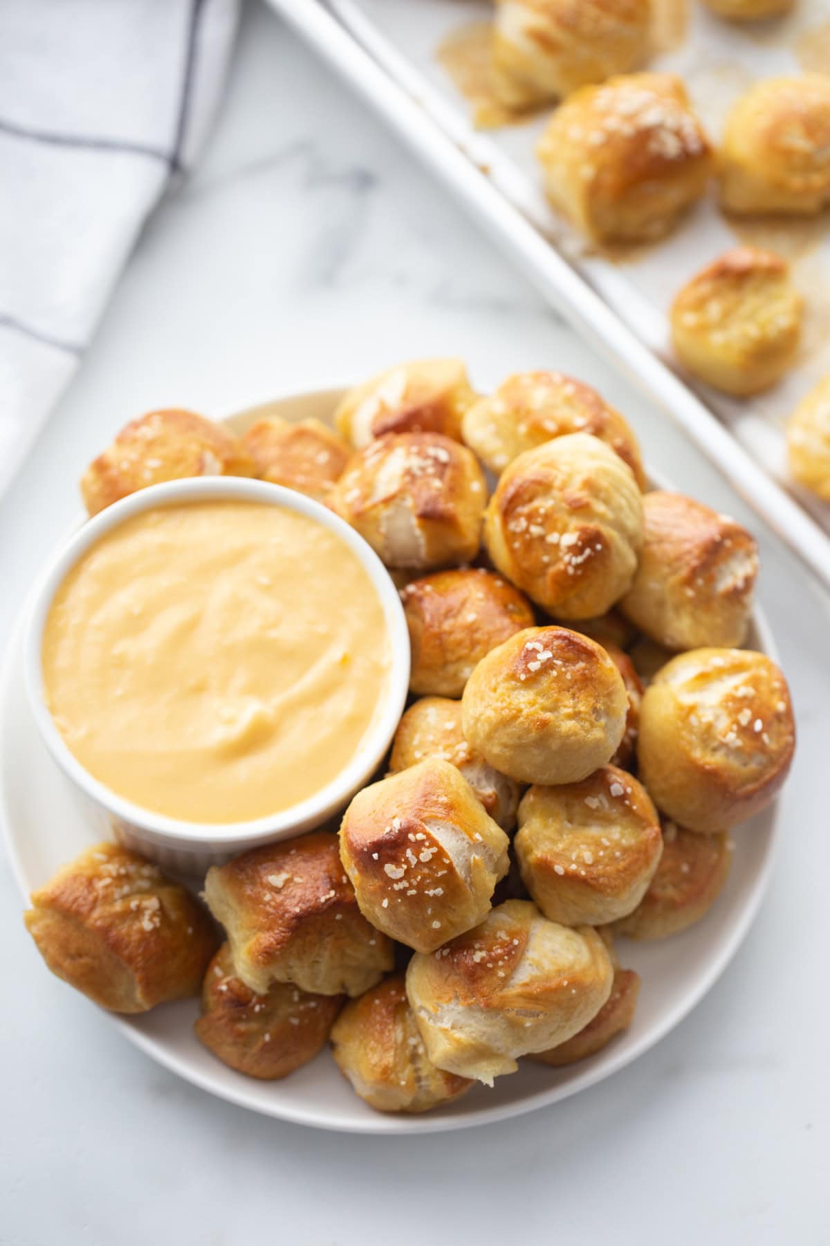 soft pretzel bites with a bowl of cheese sauce