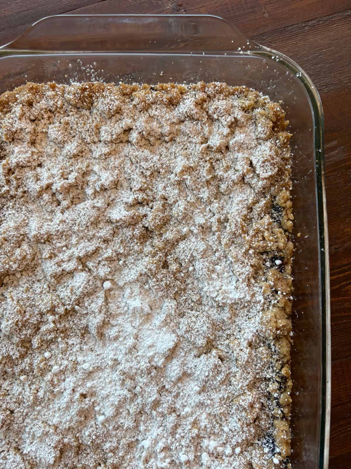Apple Butter Shortbread Bars are a totally decadent dessert with two layers of buttery shortbread and apple butter sandwiched in between. Recipe from RecipeBoy.com apple butter shortbread bars in pan before cutting