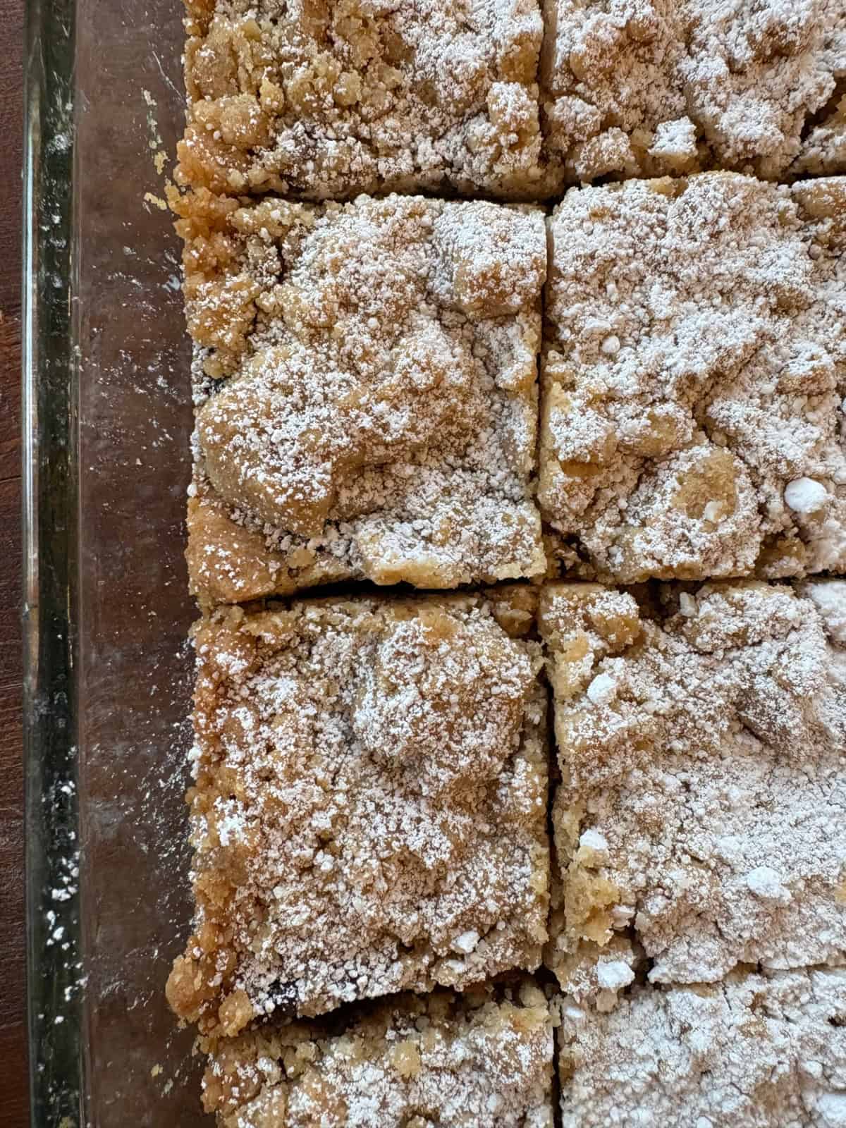 Apple Butter Shortbread Bars are a totally decadent dessert with two layers of buttery shortbread and apple butter sandwiched in between. Recipe from RecipeBoy.com overhead shot of apple butter shortbread bars cut in the pan