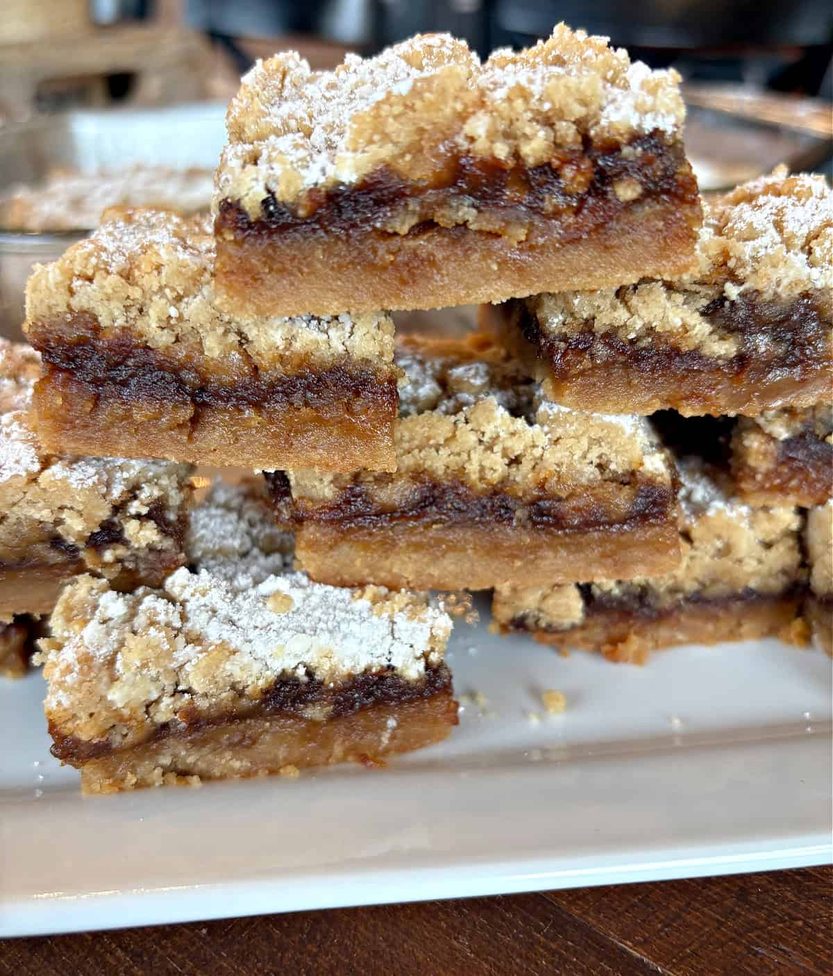 Apple Butter Shortbread Bars are a totally decadent dessert with two layers of buttery shortbread and apple butter sandwiched in between. Recipe from RecipeBoy.com stack of apple butter shortbread bars