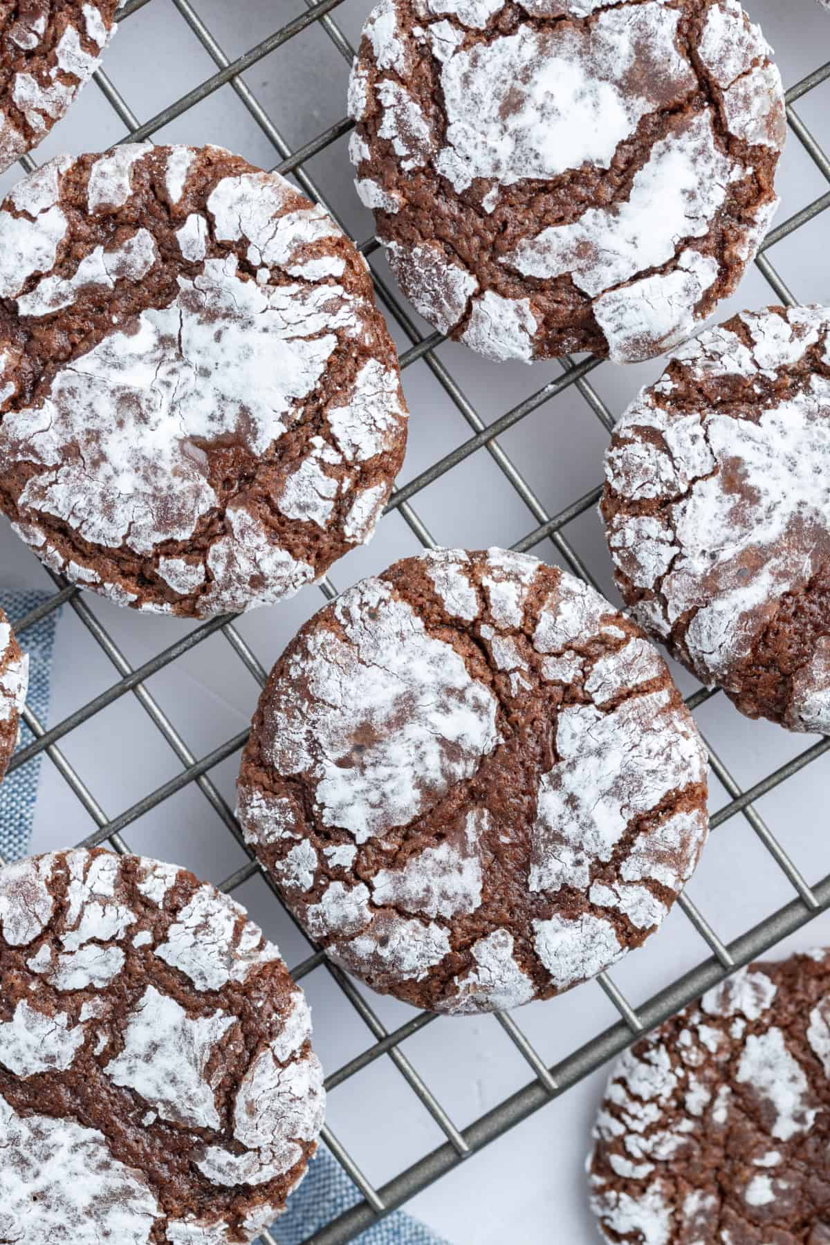 chocolate crackles cookies on a cooling rack 