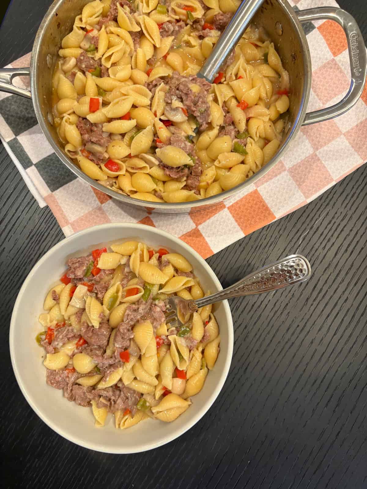 philly cheesesteak pasta in pot and serving in bowl