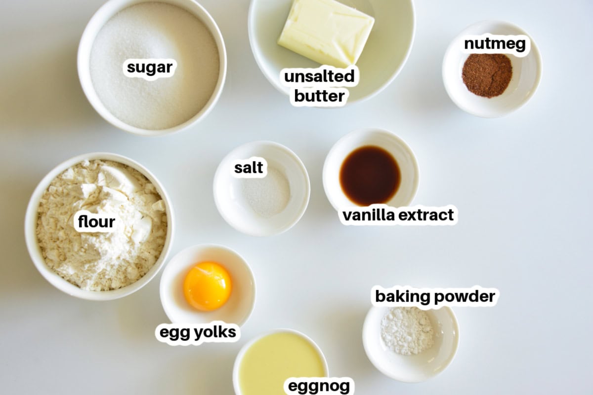 These soft and tender Eggnog Cookies taste just like classic holiday eggnog! Rolled in sugar and full of nutmeg flavor—perfect for Christmas cookie trays. ingredients displayed for making eggnog cookies