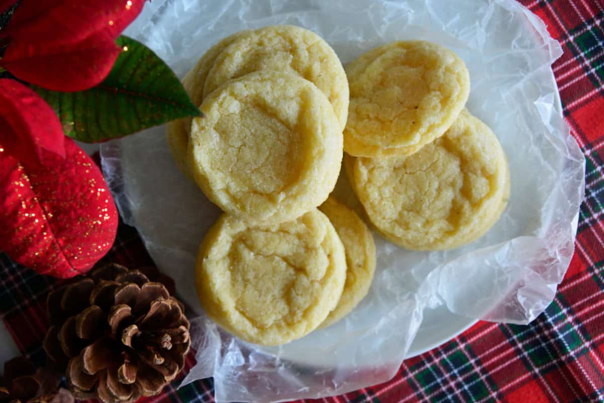 These soft and tender Eggnog Cookies taste just like classic holiday eggnog! Rolled in sugar and full of nutmeg flavor—perfect for Christmas cookie trays. eggnog cookies with pine cones