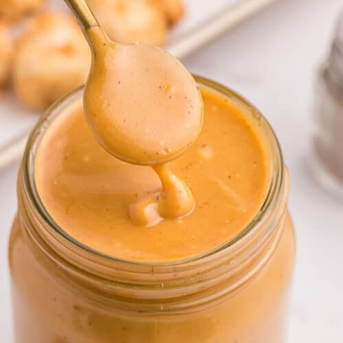 spooning into jar of copycat chick-fil-a sauce