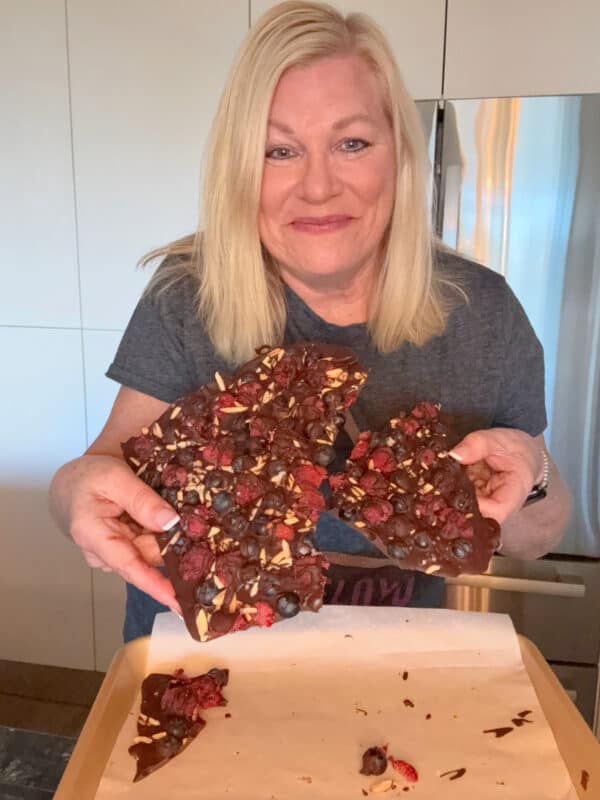 Recipegirl holding chocolate berry bark