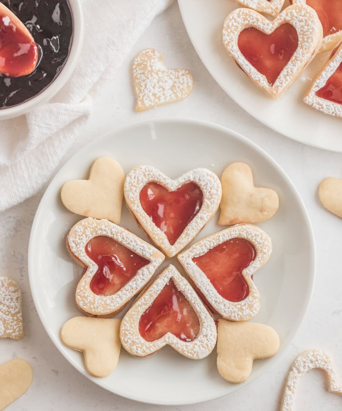 linzer heart cookies on a plate